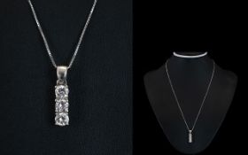 18ct White Gold Set 3 Stone Drop Pendant with Attached 9ct Gold Chain.