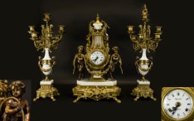 A 20th Century Brass And Marble Cased Clock Garniture In the Louis XV style, the movement by EHS
