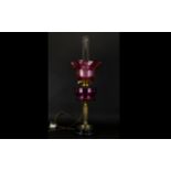 Cranberry Glass and Brass Oil Lamp Converted oil lamp on circular base with brass stand and fluted /