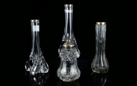 Pair of Clear Molded Glass Vases with silver rims, Together with one other similar and a silver