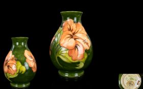 Moorcroft - Signed Tube lined Ovoid Shaped Vase ' Coral Hibiscus ' Design on Emerald Green Ground,