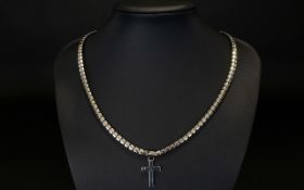 DKNY Designer Pendant and Chain, a chunky set necklace with pendant in the form of a cross.
