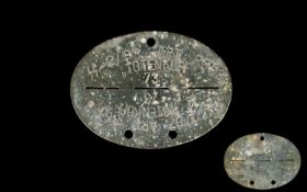 WWII Interest Original SS Panzar Art Reg Totenkopf Dog Tag Oval tag with aged patina. 3 inches in