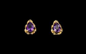 14ct Gold Amethyst Set Pair of Earrings of Attractive Form. Marked 14ct.