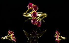 Ruby Five Stone Ring, a trail of five oval cut rubies, totalling 2.