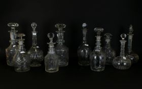 A Large Collection Of Cut Glass Decanters Ten in total of varying designs to include, ships