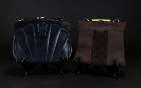 Two Art Deco Evening Bags Each circa 1930's. The first of soft black leather with black suede back