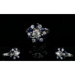 18ct White Gold Diamond and Sapphire Dress Ring, In a Flower head Design Setting. The Diamonds and