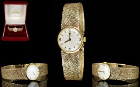 Omega Ladies 9ct Gold Mechanical Wrist Watch with Integral 9ct Gold Mesh Bracelet.