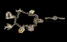A Silver Bracelet Loaded With Six Silver Charms And Padlock All fully hallmarked for silver. Plus