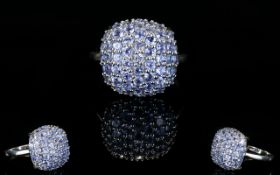 Tanzanite Cluster Ring, a square cushion of closely set, round cut tanzanites,