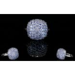 Tanzanite Cluster Ring, a square cushion of closely set, round cut tanzanites,