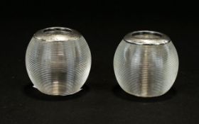 A Pair Of Globular Shaped Silver Topped Match Strikers. Hallmarked Rubbed. Hight 2 Inches.