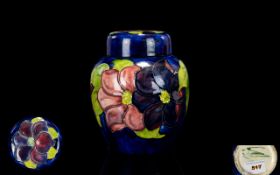 Moorcroft Tube lined and Signed Lidded Ginger Jar ' Clematis ' Design on Blue Ground. Moorcroft