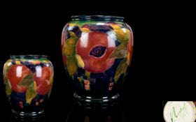 William Moorcroft Signed and Dated Ovoid Shaped Vase ' Ochre Pomegranate ' Design on Blue Ground.