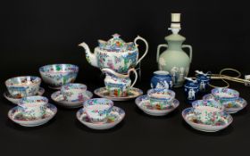 English Chinoiserie Tea Set, comprising one tea pot, milk jug, sugar bowl, slop bowl, 6 tea bowls