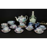 English Chinoiserie Tea Set, comprising one tea pot, milk jug, sugar bowl, slop bowl, 6 tea bowls