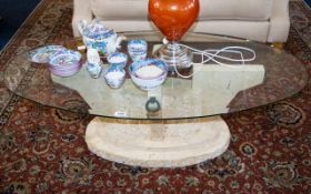 Contemporary Glass Coffee Table with stonework effect pillar to base and oval glass top. 50 inches