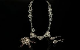 A Collection Of Pewter Tone Vintage Costume Jewellery An unusual collection of three items to