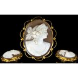 9ct Gold Mounted Shell Cameo Brooch with attached 9ct gold safety chain. Marked 9ct. Depicts