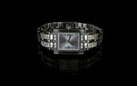 A Ladies Swatch Limited Edition Wrist Watch with a square face and jewelled bracelet.