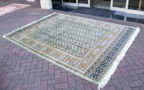 A Very Large Woven Silk Bokhara Carpet Ornate silk carpet with traditional lozenge and geometric