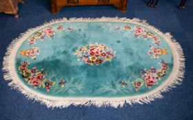 Oval Orinetal Rug Woven rug in Robin's egg blue with orinetal floral design to borders and cotton