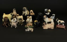 A Large Collection Of Pug Figurines Approx 20 items in total to include several resin figures, pug