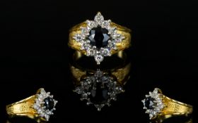 18ct Gold - Diamond and Sapphire Cluster Ring, Flower head Design and Setting.