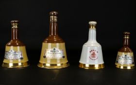 Whisky Interest. Four Bottles Of Bells Blended Scotch Whisky. One Bottle To Commemorate The Birth Of