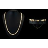 A Nice Quality Single Strand Pearl Necklace with a 14ct Gold Clasp and Safety Chain.
