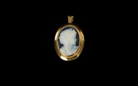Gold Cameo Pendant/ convertible brooch hallmarked to back, set with central female cameo.