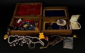 Two Wooden Jewellery Boxes containing a quantity of assorted costume jewellery, coins, brooches,