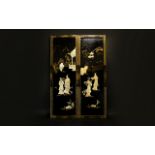 A Pair Of Oriental Panels Rectangular wood panels finished in black lacquer and gilt trim. Each