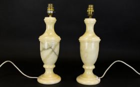 A Pair Of Onyx Table Lamps Of urn form in pale cream and grey striated onyx.