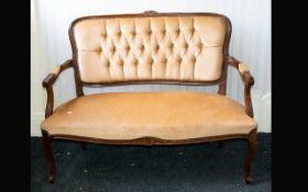Antique Love Seat Mahogany frame with carved daisy detail to back rest carved apron and legs, the
