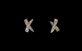 Ladies Pair of 9ct Gold Diamond Illusion Set Pair of Earrings. X Star Shaped Design. Marked for 9ct.