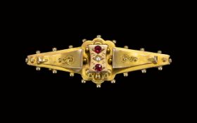 Victorian Period Attractive 9ct Gold Ruby and Seed Pearl Brooch. Fully Hallmarked for 9ct.