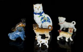 A Collection Of 19th/20th Century Ceramic Pug Figurines Mostly continental, some with