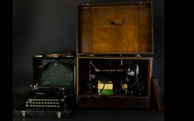 A Blick Universal Typewriter In Fitted Case Together With A Singer Sowing Machine Numbered