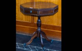 A Mid Twentieth Century Mahogany Octagonal Pedestal Table Two frieze drawers, turned supports, brass