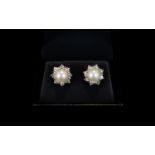 18ct White Gold - Pair of Nice Quality Diamond and Pearl Set Earrings. The Central Cultured Pearl to