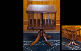 Walnut Veneerer Revolving Bookcase Of square form, turned supports raised on four splayed feet. 17