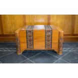 Chinese Camphor Wood Chest of shaped Deco form with a carved dragon and floral decoration, hinged