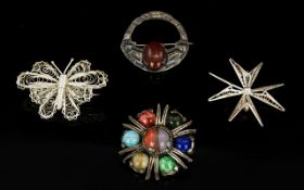 A Collection Of Four Silver And Mixed Metal Brooches A varied collection to include antique silver