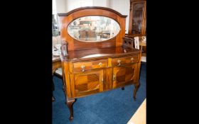 Early 20th Century Mirrored Back Sideboard Comprises two frieze drawers and cupboard beneath.