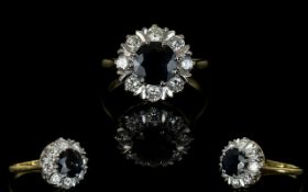 An 18ct Yellow Gold Sapphire And Diamond Ring Contemporary flowerhead setting with large central