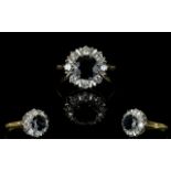 An 18ct Yellow Gold Sapphire And Diamond Ring Contemporary flowerhead setting with large central