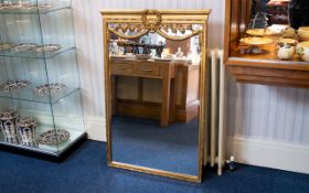 A Large Reproduction French Empire Style Mirror Large bevelled glass mirror in ornate yellow gilt