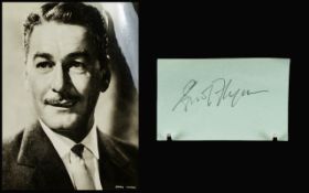 Errol Flynn Autograph on page(vintage), plus 10 x 8 black and white photograph.
